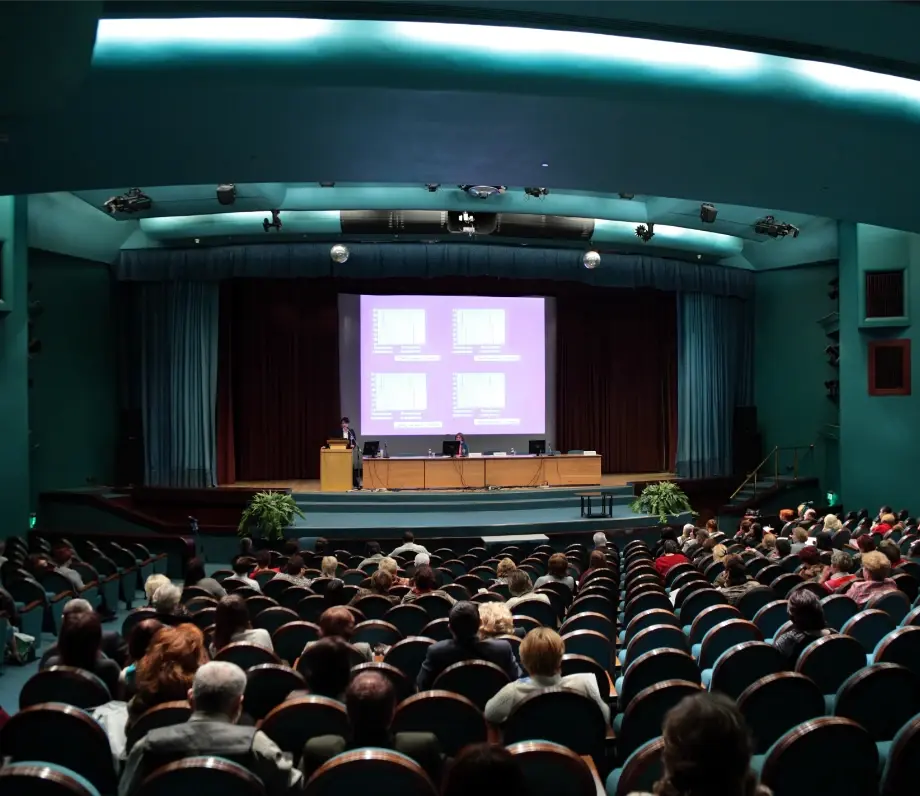 Large auditorium with presentation happening